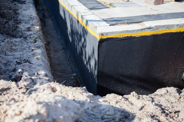 Professional Waterproofing technician working in Constantine, MI